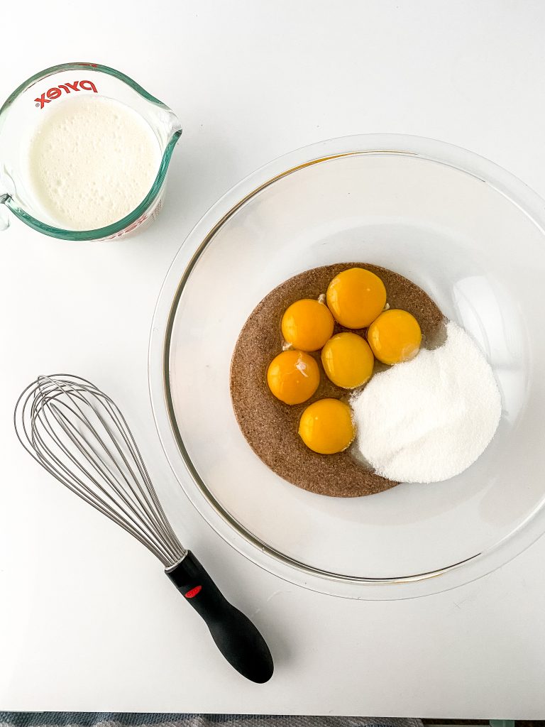 Eggnog whisk sugar in eggs